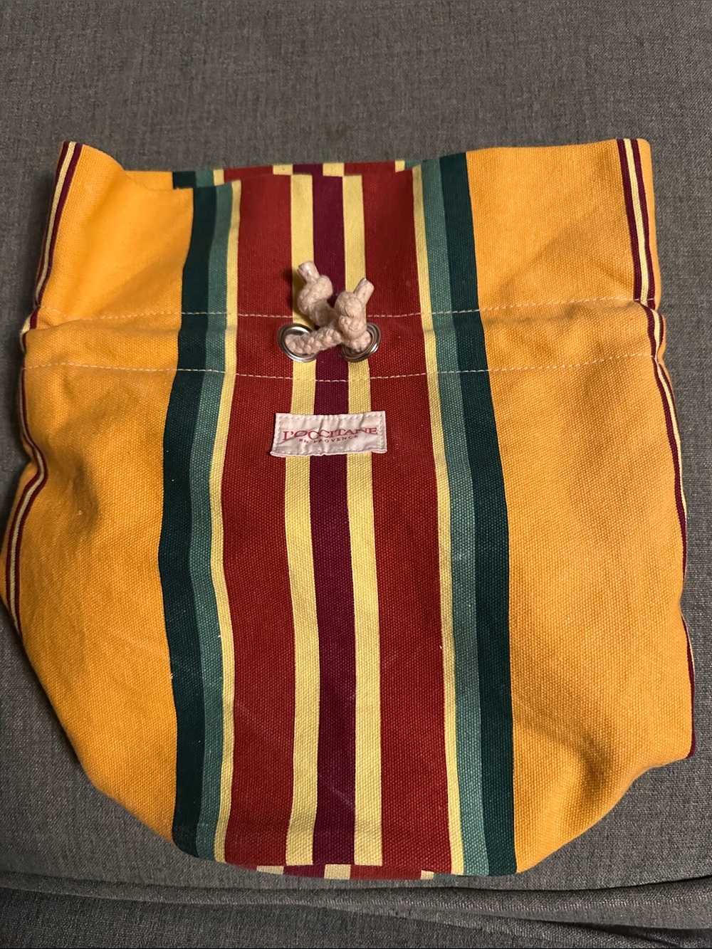 L'OCCITANE Red, Yellow & Burgundy Striped Drawstring Pouch Bucket Bag